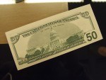 Dolar na mělkém trhu znovu posunul hranici historického minima