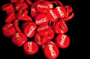 Coca-Cola zvýšila ve čtvrtletí zisk i tržby, těžila i ze znovuotevírání kin